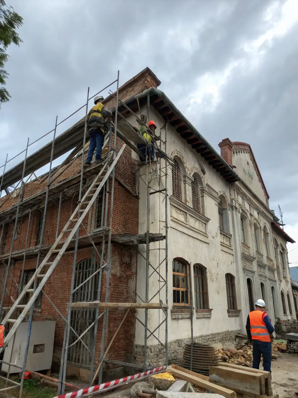 A photograph showcasing the ongoing interior renovation work inside the Peyrieu church, with visible scaffolding and restoration experts at work.